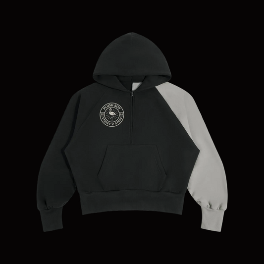 A black and gray color-blocked pullover hoodie with a PLUSH BOY logo on the left chest, displayed on a clean white background.